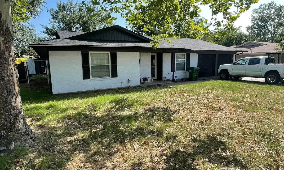 Professional roofing crew working on a residential roof in Cottleville